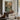 Across the Little Bridge Wall Art in a Black Floating Frame above a walnut console in a sitting room