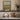 Across the Meadow Wall Art in a Gold Ornate Frame on a kitchen shelf
