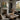 Bend in the Canal Wall Art in a Gold Ornate Frame on a fireplace mantel