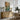Bend in the Canal Wall Art in a Natural Floating Frame above an oak sideboard in a dining room