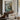 Beneath the Seawall Wall Art in a Black Floating Frame above a walnut console in a sitting room