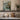 Beneath the Seawall Wall Art in a White Floating Frame on a kitchen shelf
