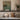 Boat at Rest Wall Art in a Black Floating Frame on a kitchen shelf