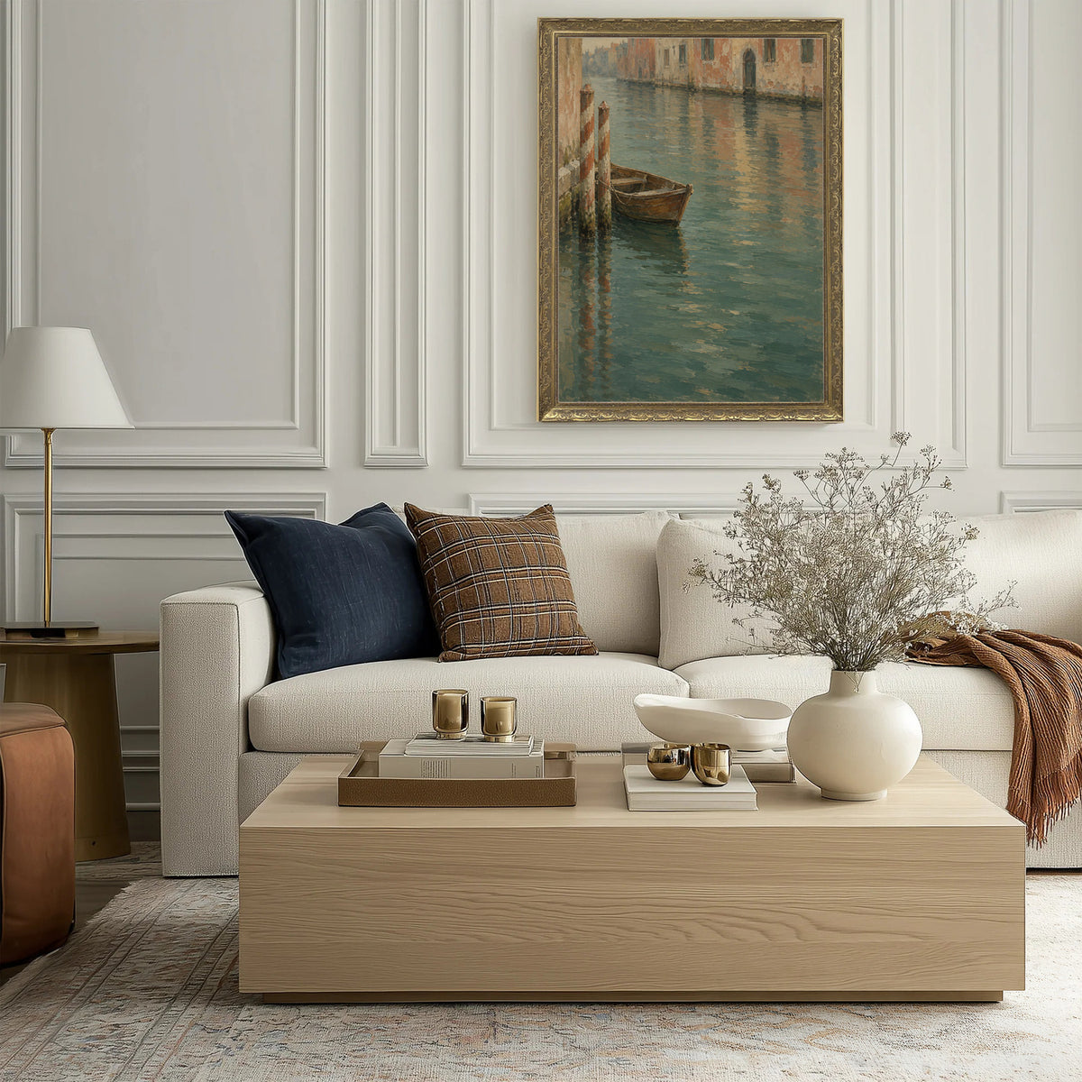 Boat at Rest Wall Art in a Gold Ornate Frame above a cream sofa in a living room
