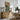 Boat at Rest Wall Art in a Natural Floating Frame above an oak sideboard in a dining room