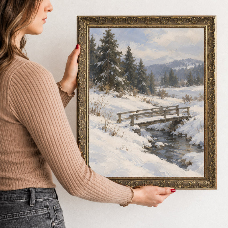 Footbridge in Snow Wall Art in a Gold Ornate Frame, held to show its size