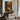 Leaves on Still Water Wall Art in a Black Floating Frame above a walnut console in a sitting room