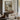 Low Tide Wall Art in a Gold Ornate Frame above a walnut console in a sitting room