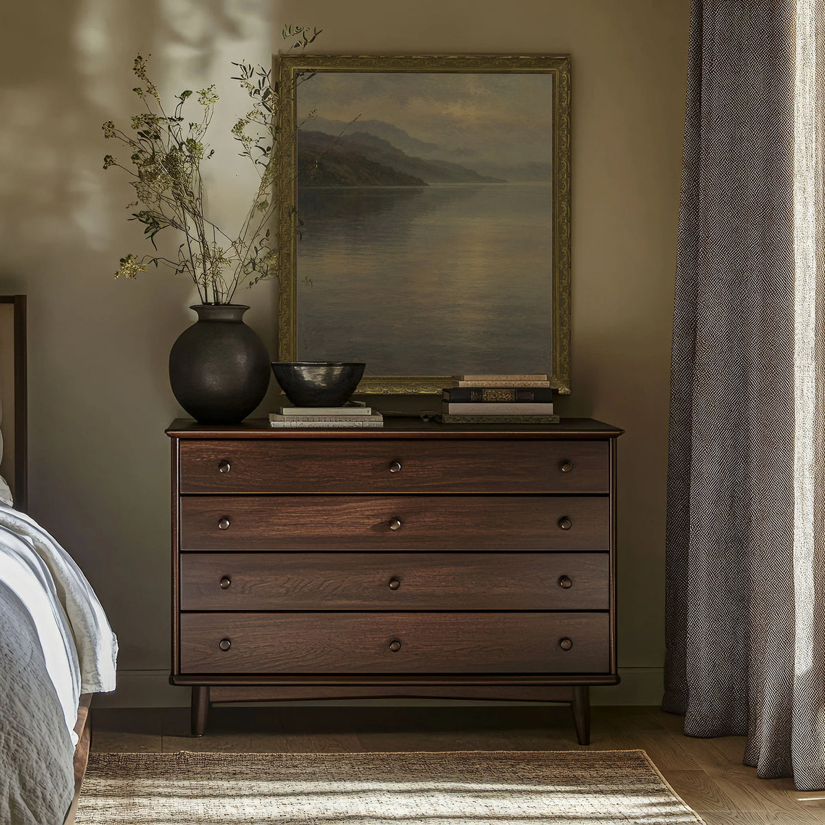 Morning Mist on the Loch Wall Art in a Gold Ornate Frame above a walnut dresser in a bedroom