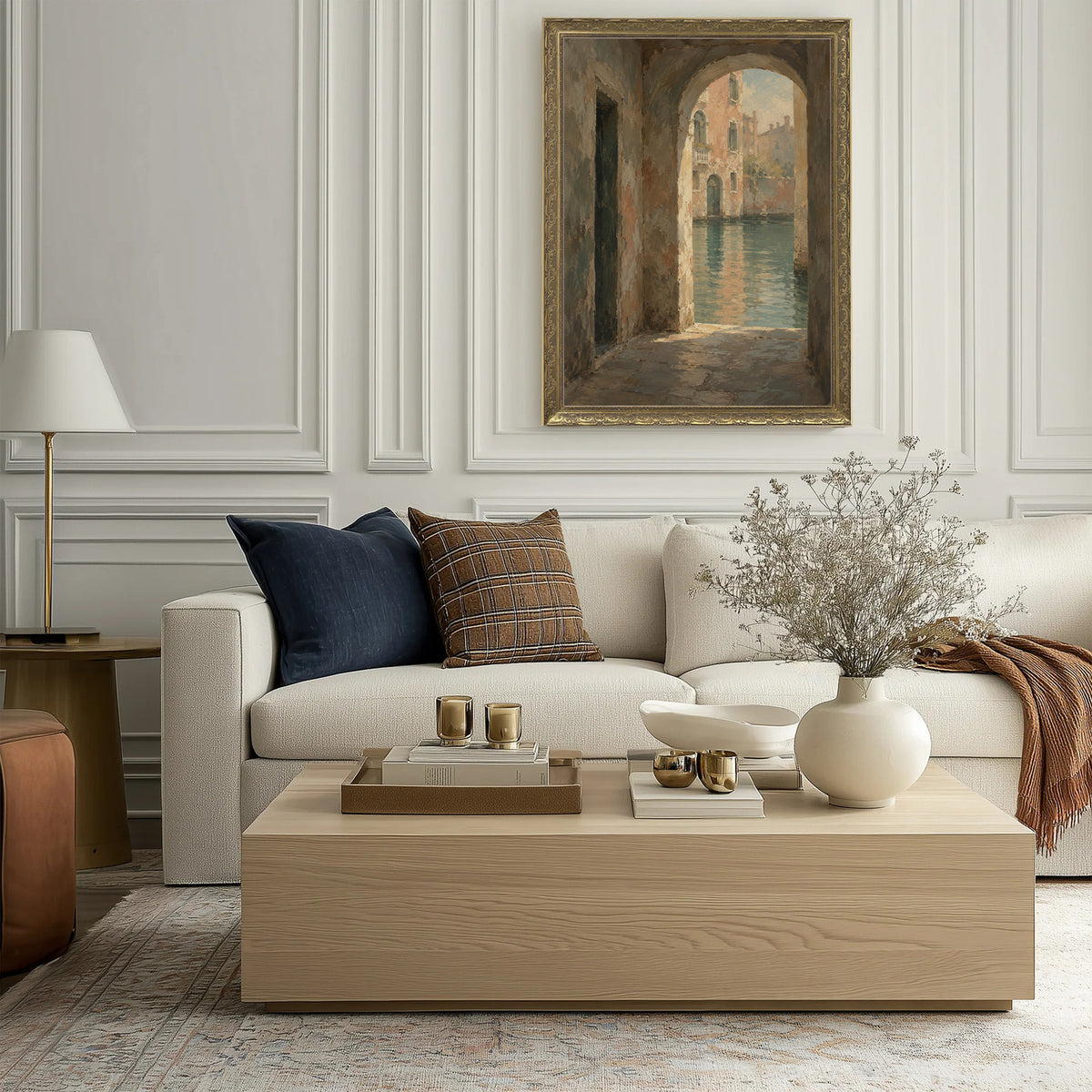 Passage to the Canal Wall Art in a Gold Ornate Frame above a cream sofa in a living room