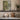 Rowboat Beneath the Willow Wall Art in a Black Floating Frame on a kitchen shelf
