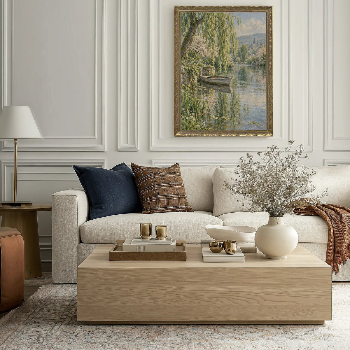 Rowboat Beneath the Willow Wall Art in a Gold Ornate Frame above a cream sofa in a living room