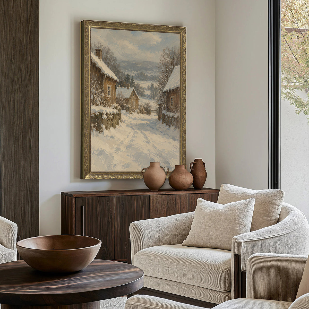 Snow on the Village Lane Wall Art in a Gold Ornate Frame above a walnut console in a sitting room