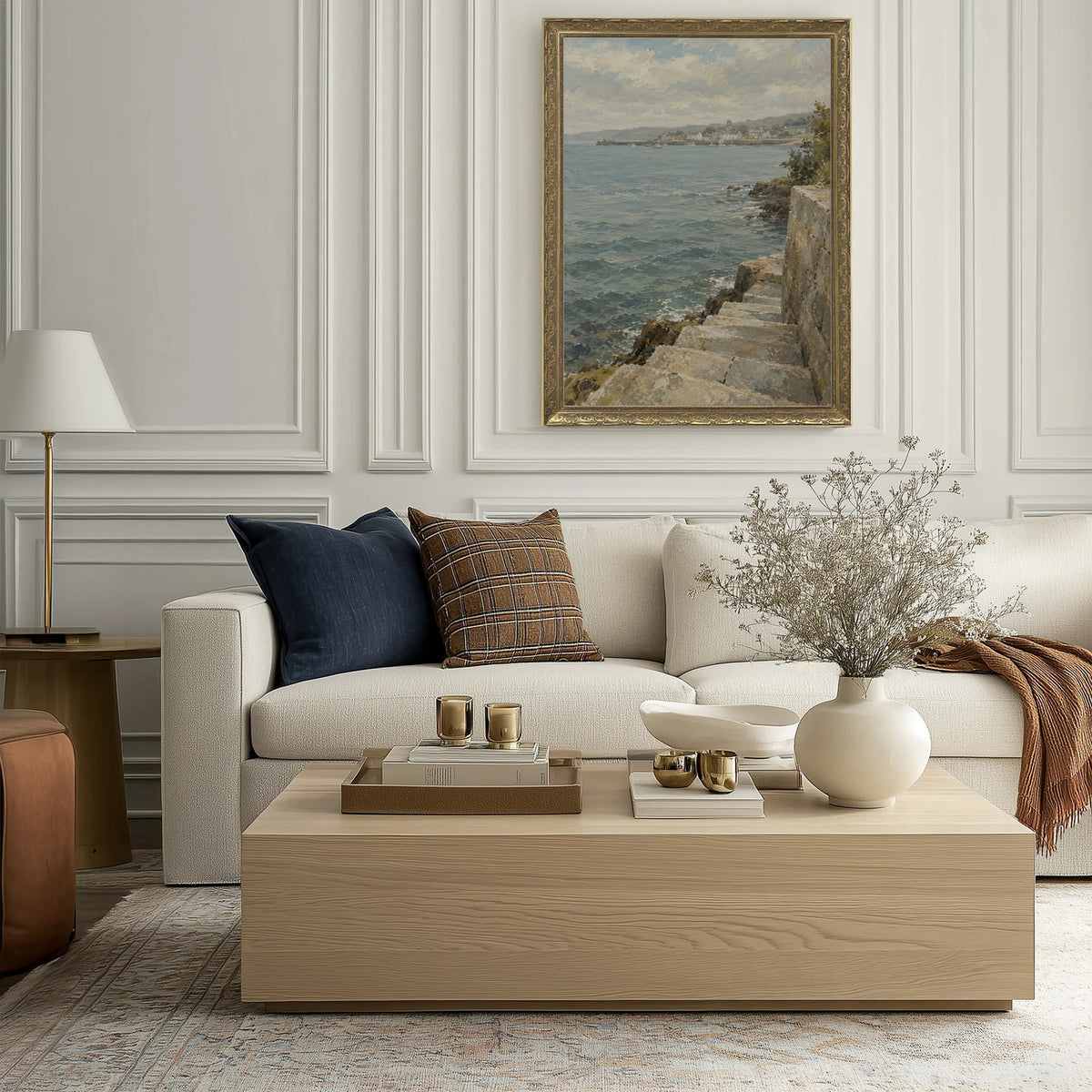 Steps to the Tide Wall Art in a Gold Ornate Frame above a cream sofa in a living room