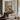 Table by the River Wall Art in a Gold Ornate Frame above a walnut console in a sitting room