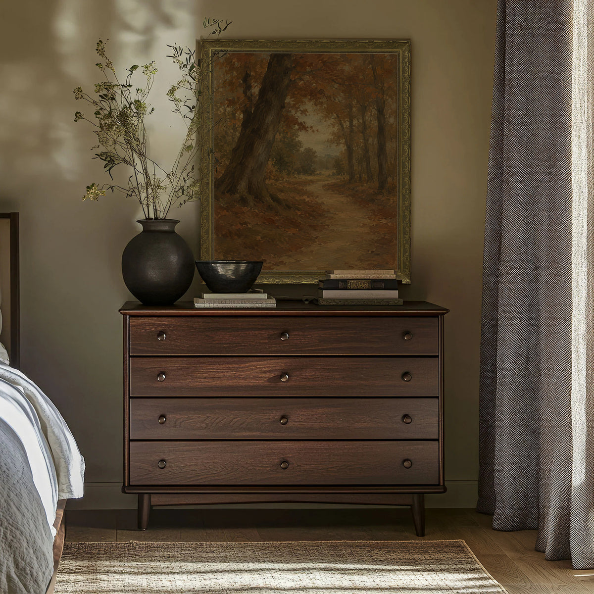 The Beech Avenue Wall Art in a Gold Ornate Frame above a walnut dresser in a bedroom