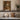The Beech Avenue Wall Art in a White Floating Frame on a kitchen shelf