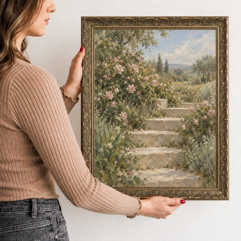 The Flowering Steps Wall Art in a Gold Ornate Frame, held to show its size