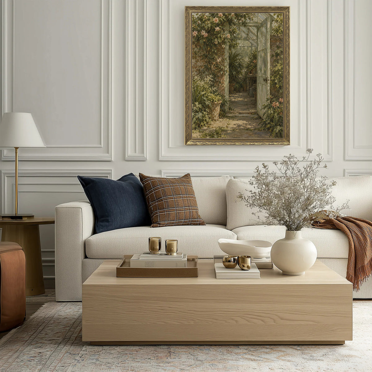 The Glasshouse Door Wall Art in a Gold Ornate Frame above a cream sofa in a living room