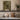 The Glasshouse Door Wall Art in a White Floating Frame on a kitchen shelf