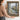 The Harbour Window Wall Art in a Gold Ornate Frame, held to show its size