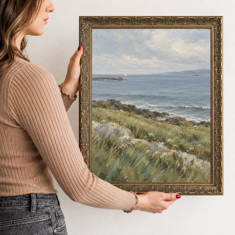 The Headland Wall Art in a Gold Ornate Frame, held to show its size