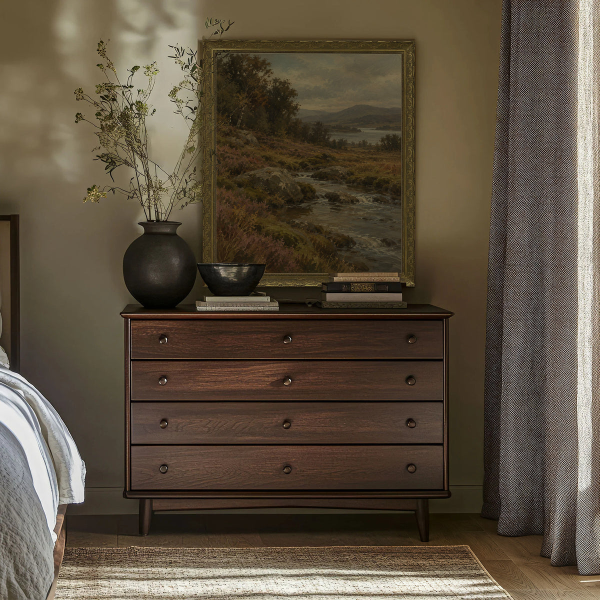 The Highland Burn Wall Art in a Gold Ornate Frame above a walnut dresser in a bedroom