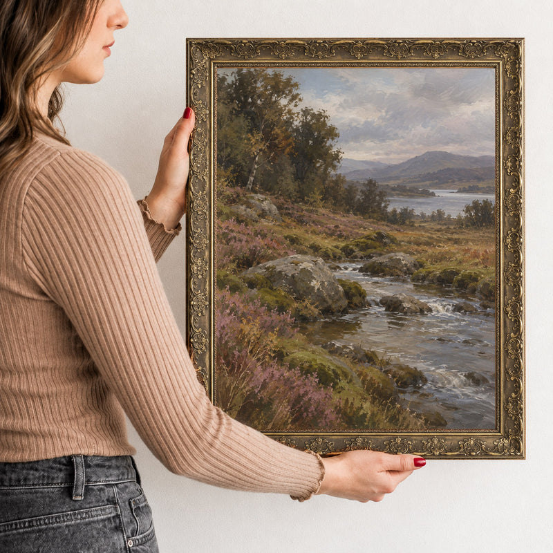 The Highland Burn Wall Art in a Gold Ornate Frame, held to show its size