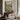 The Low Footbridge Wall Art in a Black Floating Frame above a walnut console in a sitting room