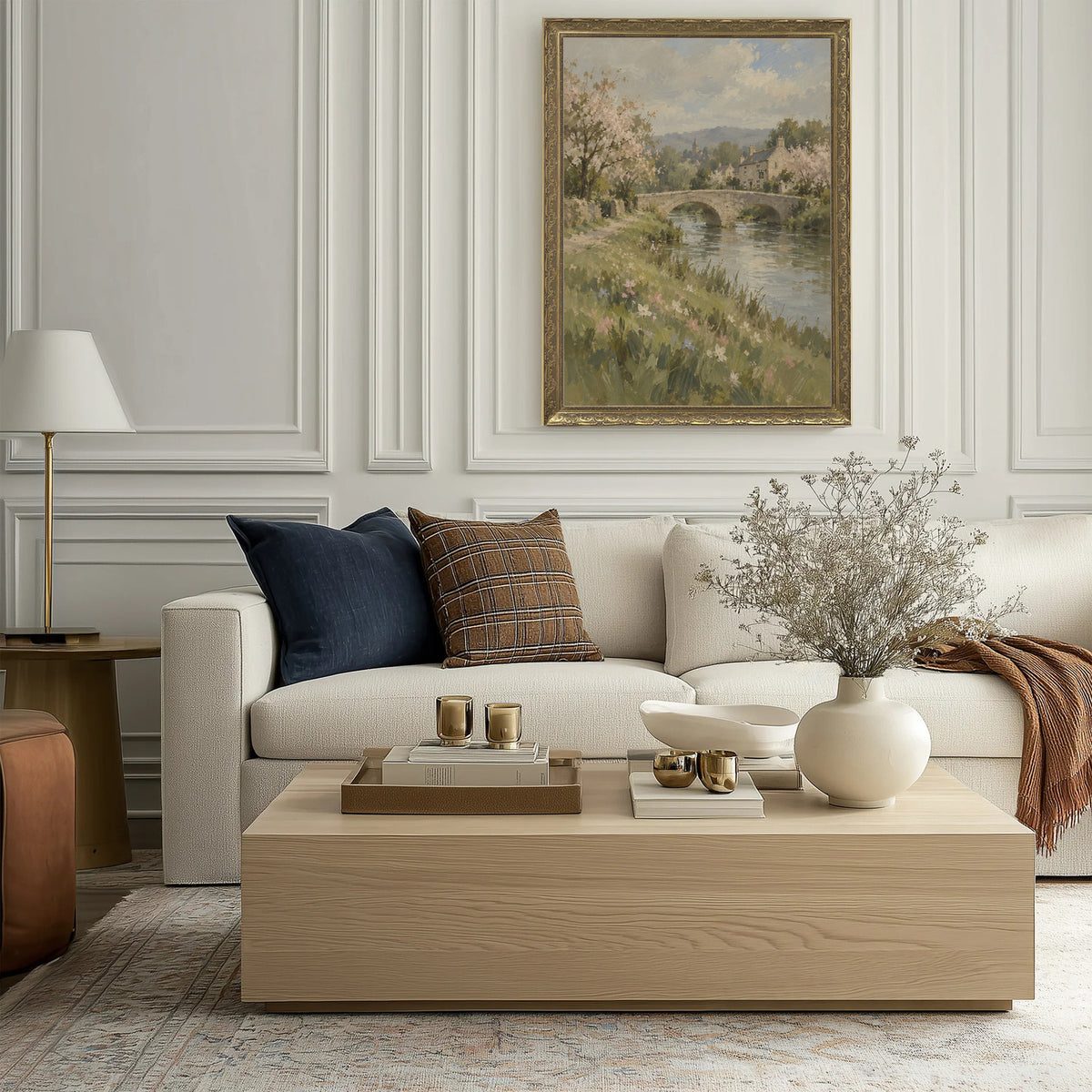 The Low Footbridge Wall Art in a Gold Ornate Frame above a cream sofa in a living room