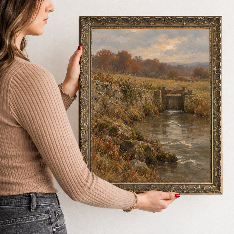 The Millrace Wall Art in a Gold Ornate Frame, held to show its size