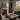 The Mountain Lake Wall Art in a Black Floating Frame on a fireplace mantel
