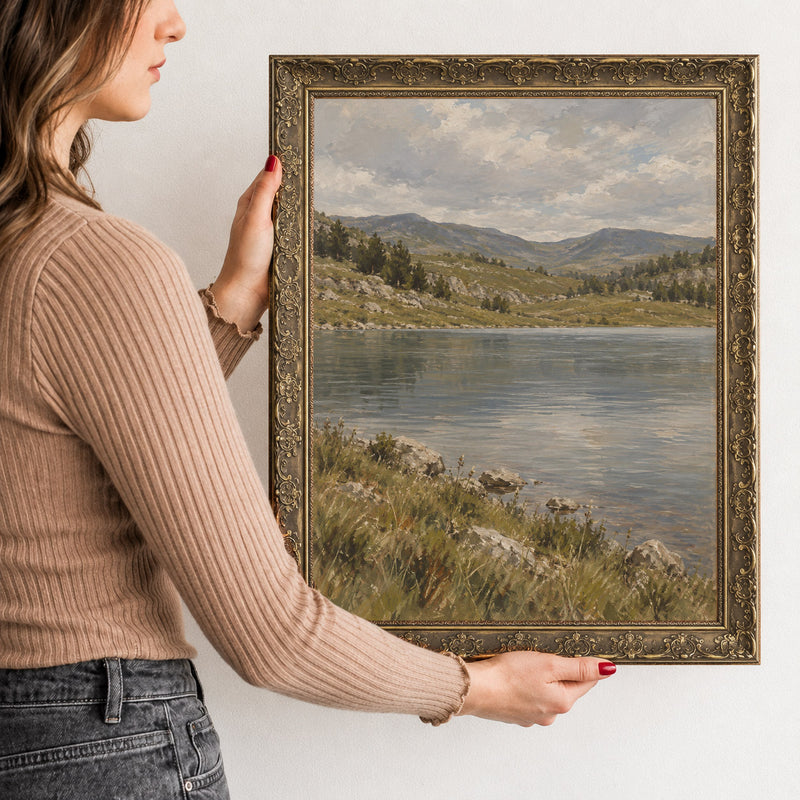 The Mountain Lake Wall Art in a Gold Ornate Frame, held to show its size