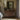 The Net Loft Wall Art in a Gold Ornate Frame above a walnut dresser in a bedroom