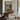 The Old Boathouse Wall Art in a Gold Ornate Frame above a walnut console in a sitting room