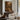 The Old Mill Wall Art in a Black Floating Frame above a walnut console in a sitting room