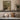 The Potting Bench Wall Art in a Gold Ornate Frame on a kitchen shelf