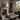 The Potting Bench Wall Art in a White Floating Frame on a fireplace mantel