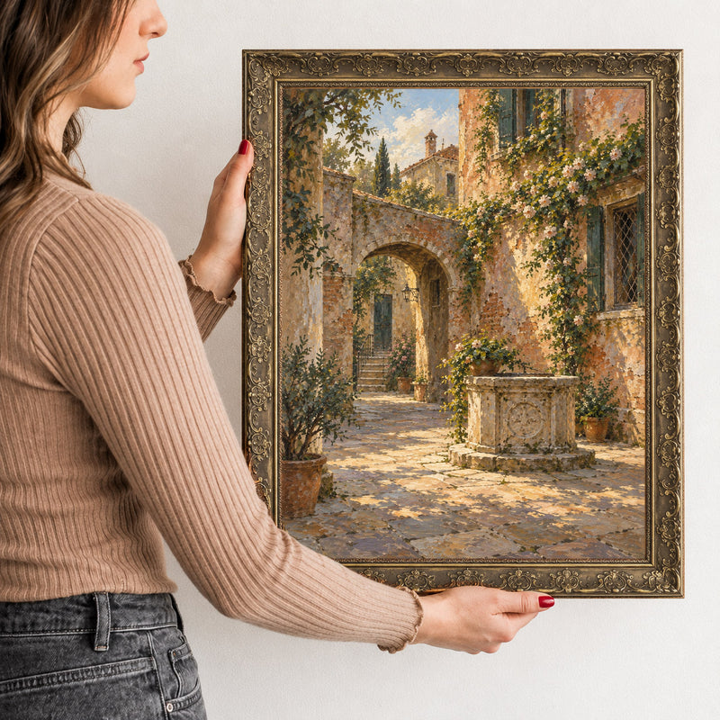 The Quiet Courtyard Wall Art in a Gold Ornate Frame, held to show its size