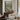 The River Inn Wall Art in a Black Floating Frame above a walnut console in a sitting room