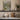 The River Inn Wall Art in a White Floating Frame on a kitchen shelf