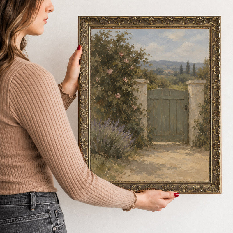 The Rose Gate Wall Art in a Gold Ornate Frame, held to show its size