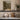 The Rose Gate Wall Art in a White Floating Frame on a kitchen shelf