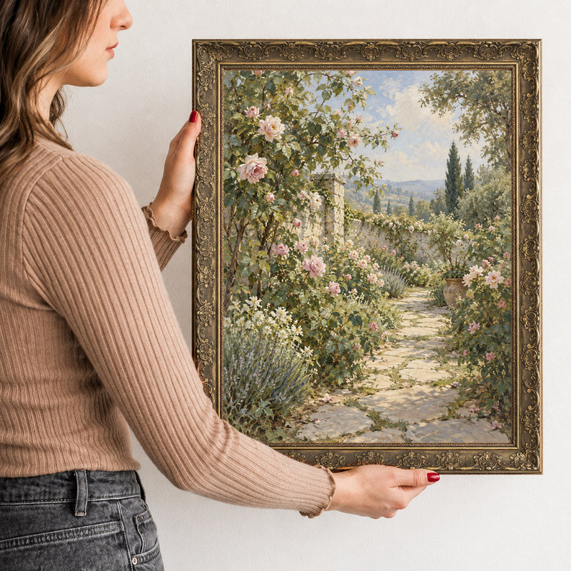 The Rose Walk Wall Art in a Gold Ornate Frame, held to show its size