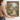 The Rose Walk Wall Art in a Gold Ornate Frame, held to show its size