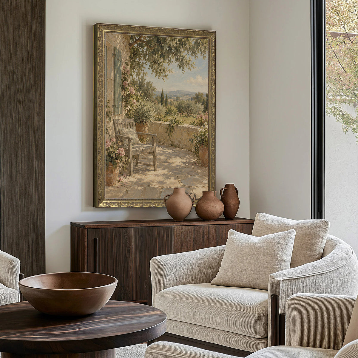 The Shaded Terrace Wall Art in a Gold Ornate Frame above a walnut console in a sitting room