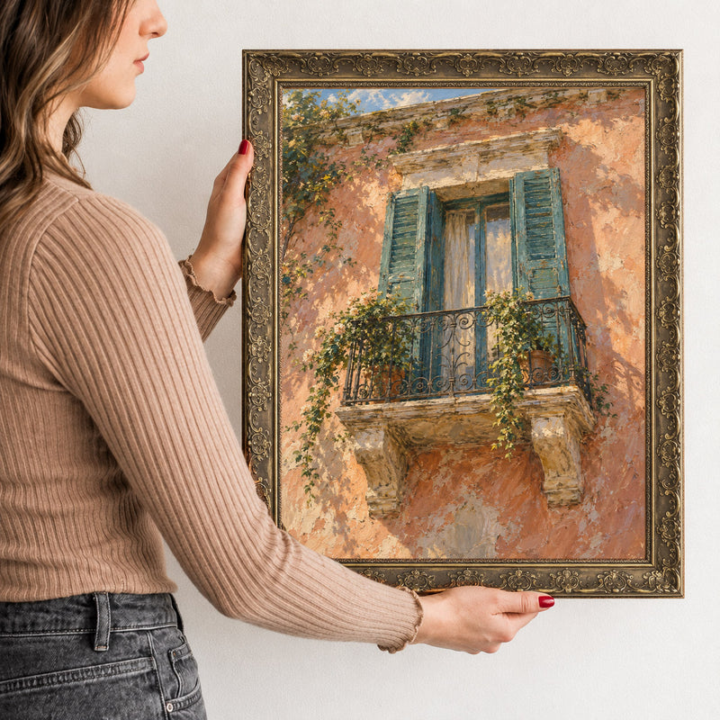 The Shuttered Balcony Wall Art in a Gold Ornate Frame, held to show its size