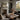 The Spruce Clearing Wall Art in a Black Floating Frame on a fireplace mantel