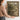 The Stone Basin Wall Art in a Gold Ornate Frame, held to show its size