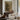 The Stone Basin Wall Art in a Gold Ornate Frame above a walnut console in a sitting room